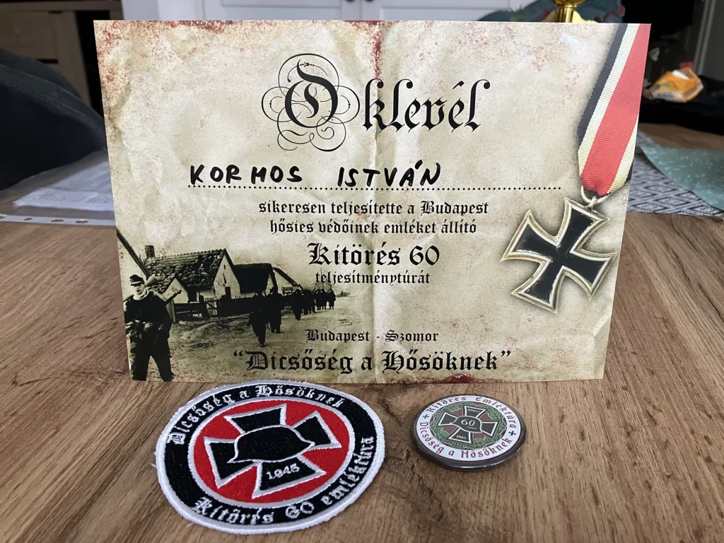 A túráért járó oklevél, kitűző és felvarró.